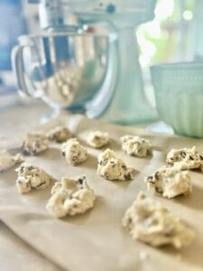 A picture of chocolate chip cookie dough before cookies are baked