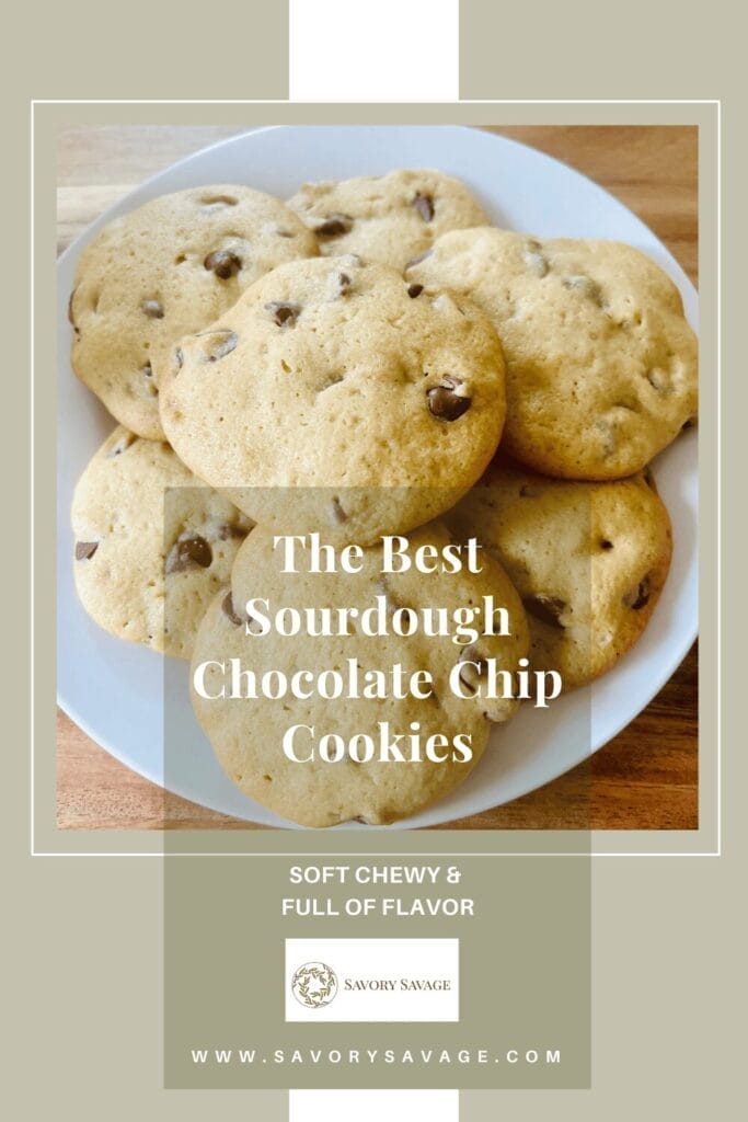 A plate of warm, freshly baked sourdough chocolate chip cookies, topped with a sprinkle of sea salt, accompanied by a glass of cold milk.